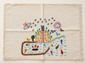 Mantel individual bordado Janitzio, casas amarillas: vista principal (imagen ilustrativa creada con IA)